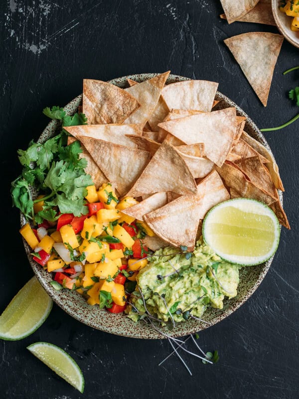Baked corn chips with guacamole and mango salsa
