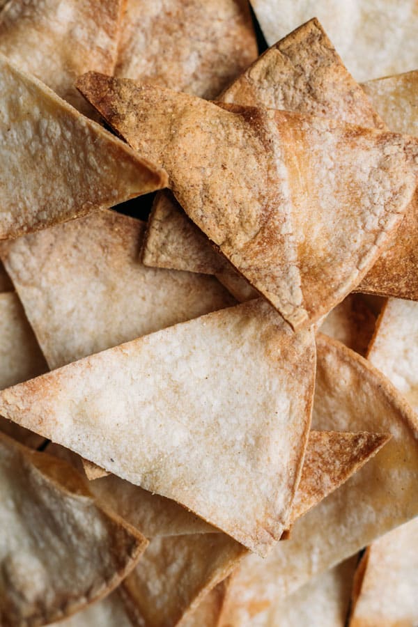 Baked corn chips with guacamole and mango salsa
