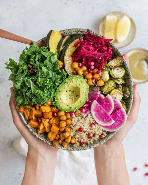 This healthy vegan fall harvest buddha bowl recipe is loaded with nourishing ingredients like sweet potato and chickpeas! Enjoy this healthy bowl for lunch or dinner!