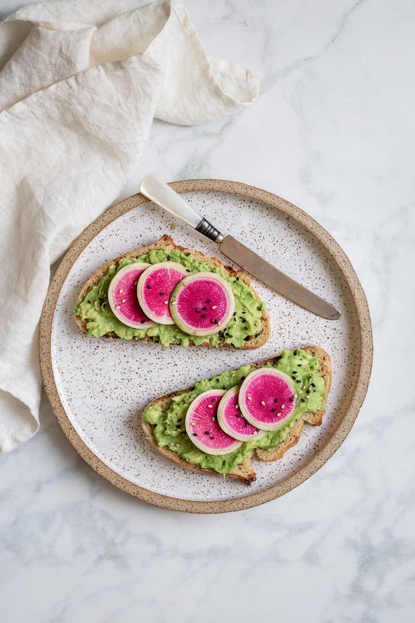 This smashed avocado toast with watermelon radish is a simple and delicious breakfast that only takes 5 minutes to make!