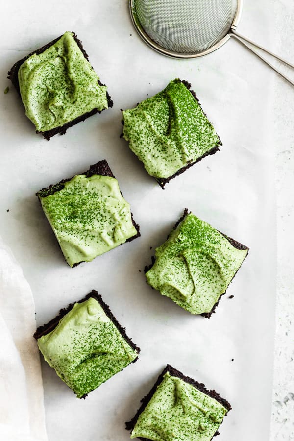 easy almond flour brownies with match frosting on counter