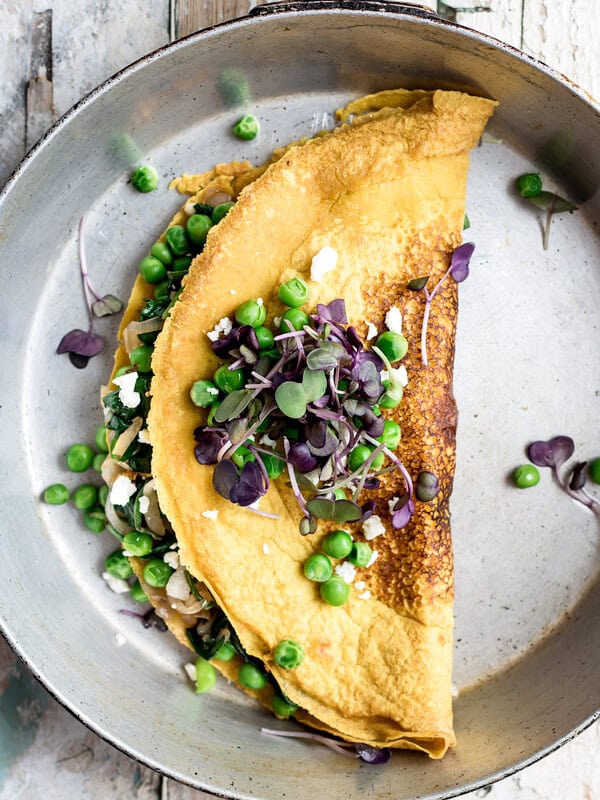 Chickpea omelette with spinach and spring peas