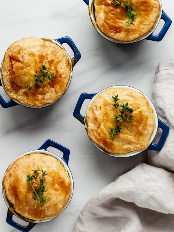 veggie pot pies in blue casserole dishes