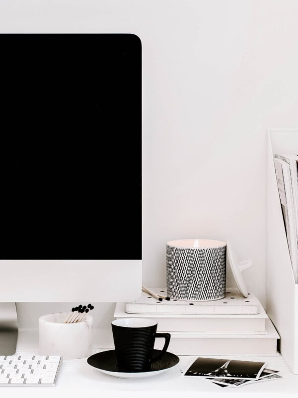desk with computer and a cup of coffee