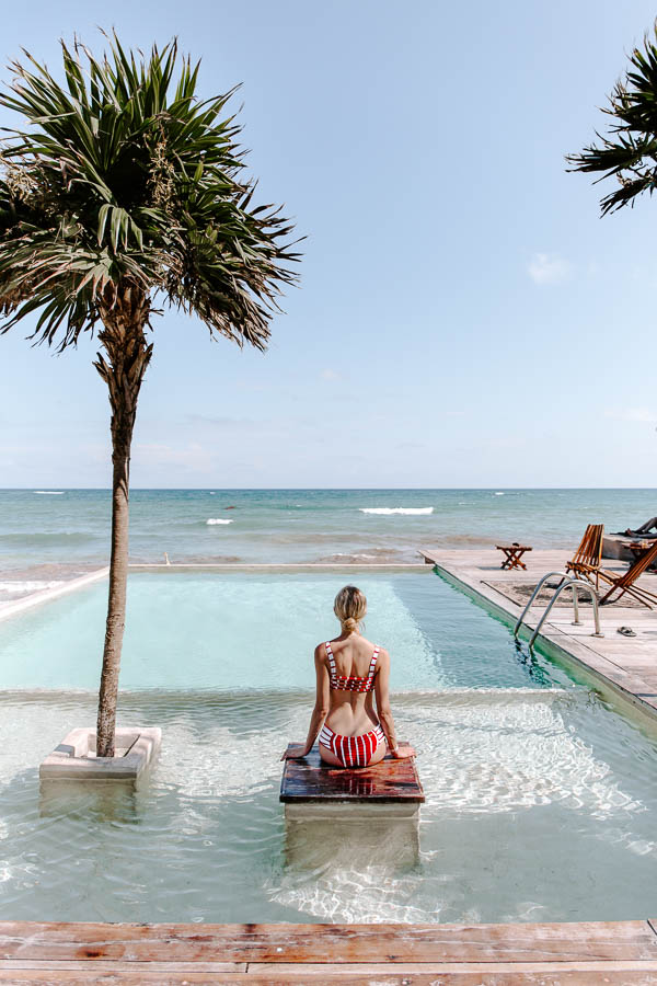 sitting in a pool in Tulum