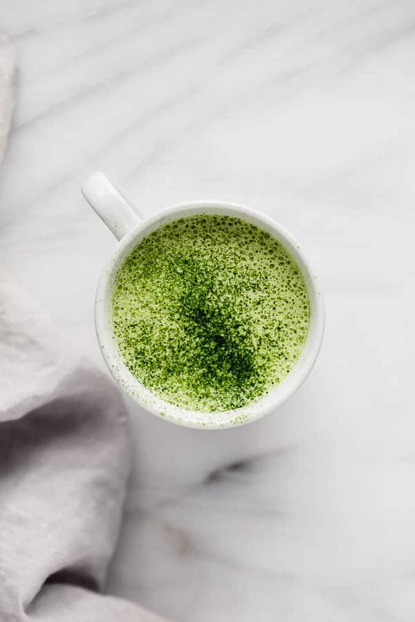 mugs filled with a matcha tea latte