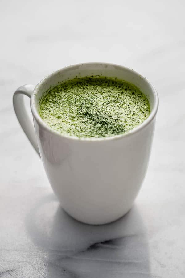 mugs filled with a matcha tea latte