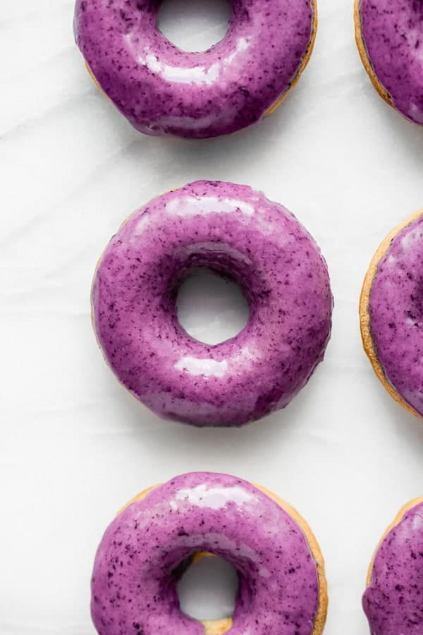 blueberry donuts on a marble board