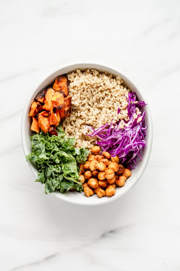 quinoa, cabbage, chickpeas, kale and sweet potato in a bowl 