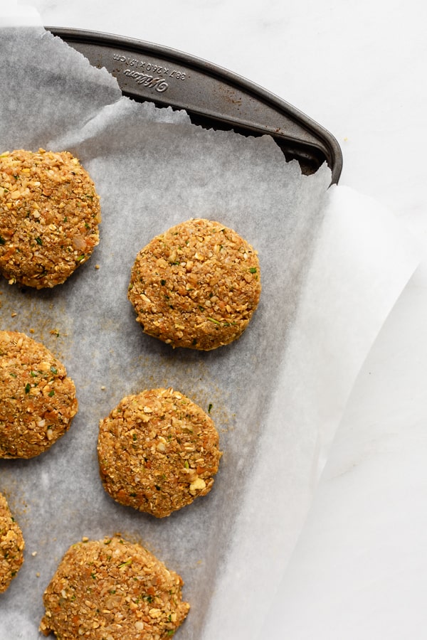 chickpea veggie burgers on a baking sheet