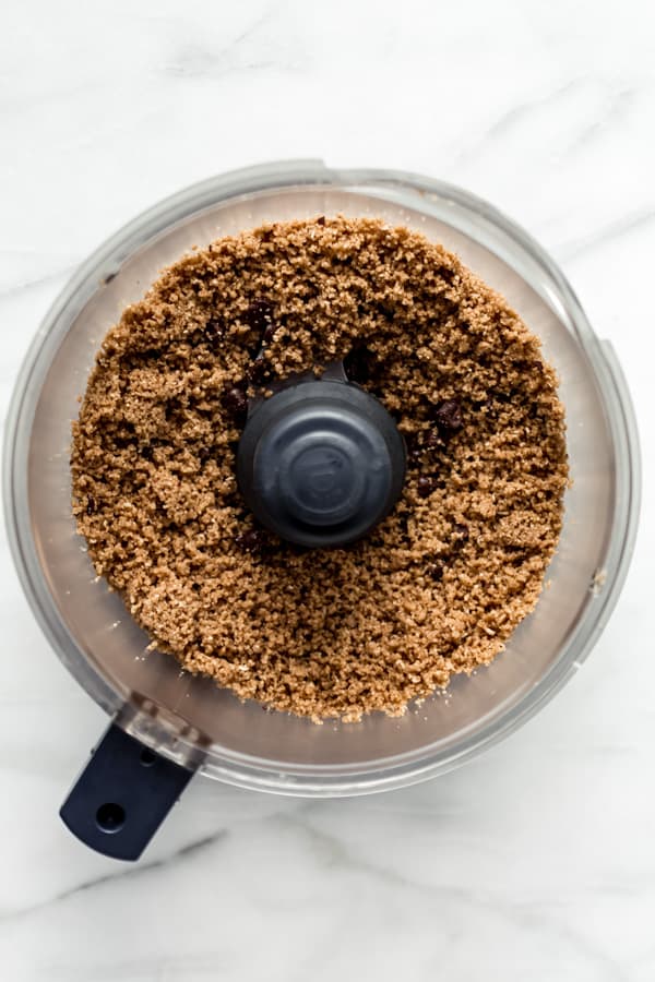 peanut butter oatmeal cookie dough crumbled in a food processor