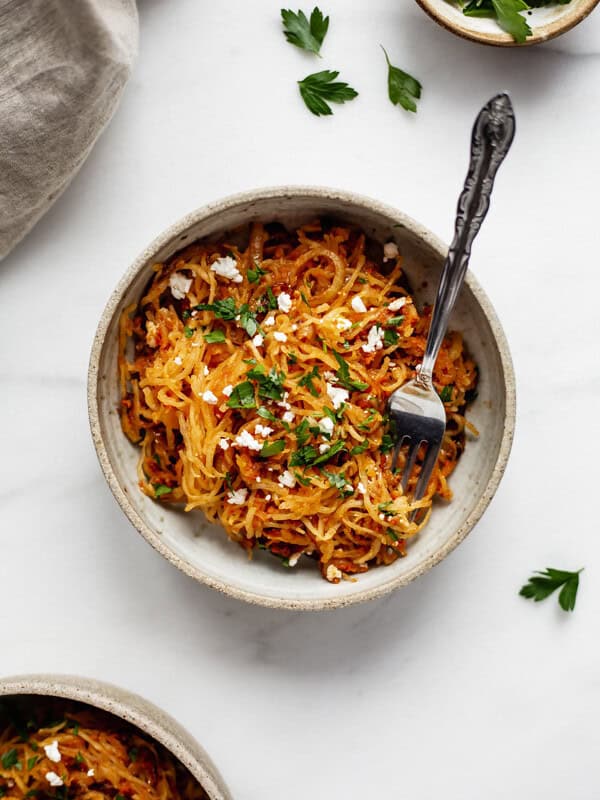 a cermaic bowl with sun dried tomato spaghetti squash