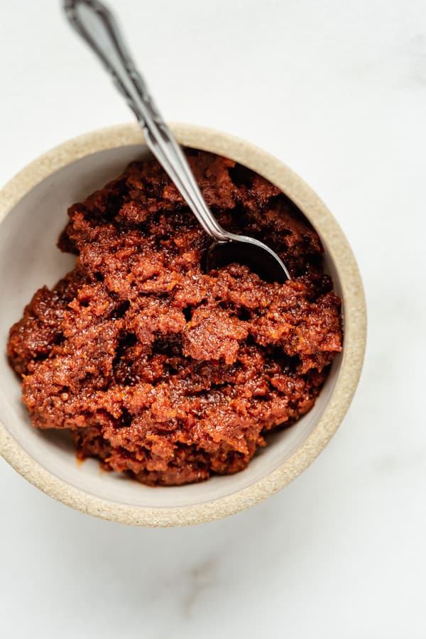 a cup of sun-dried tomato pesto