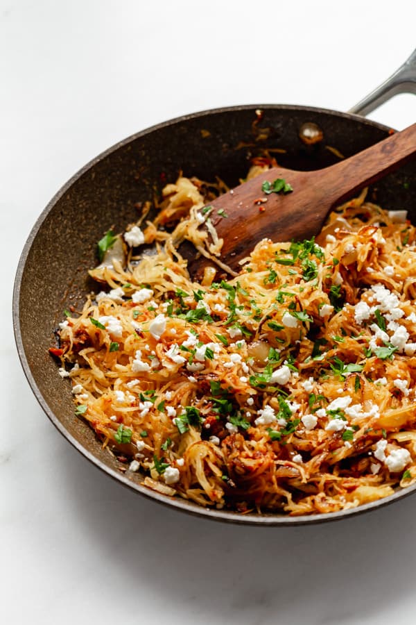a pan with sun-dried tomato pesto spaghetti squash