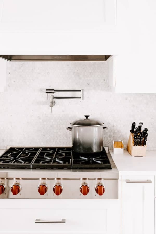 a kitche stove with a pot on it