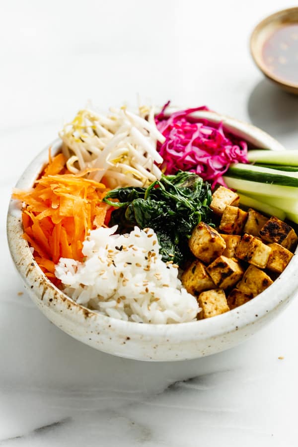 vegan bibimbap in a white ceramic bowl
