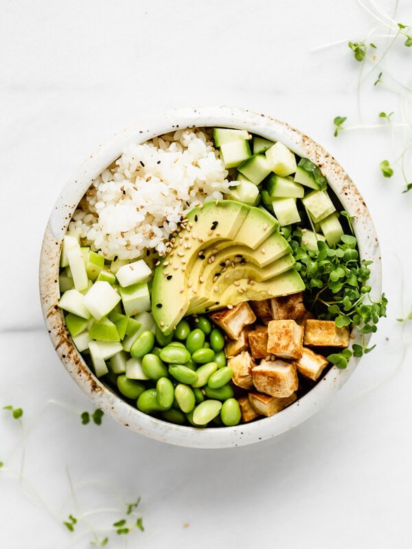 tofu rice and vegetables in a while ceramic bowl