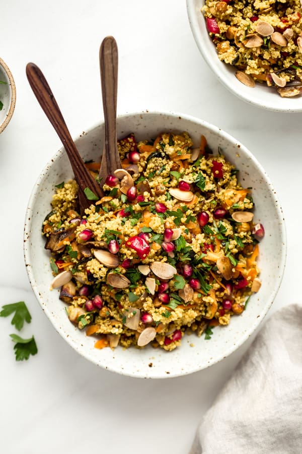 A mixing bowl with Moroccan quinoa salad in it
