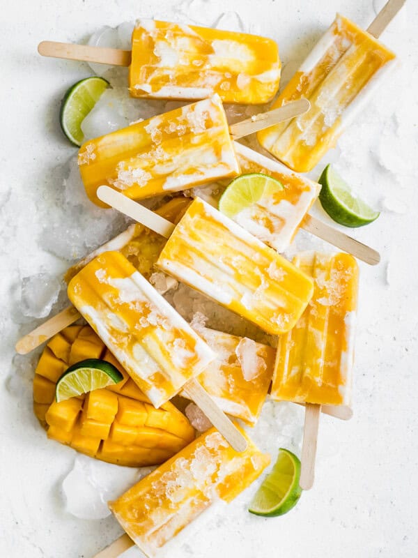 mango lassi popsicles stacked on top of each other
