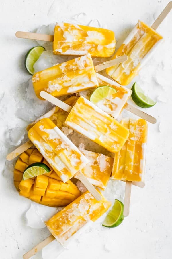 mango lassi popsicles stacked on top of each other