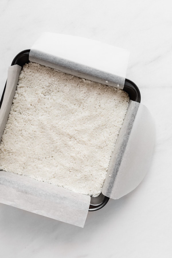 an 8x8 inch pan with coconut in it