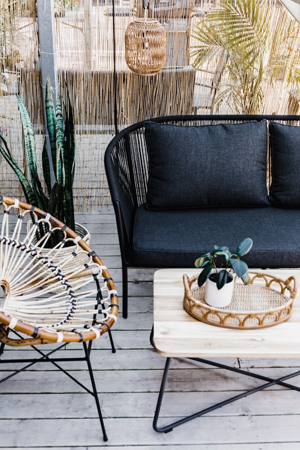 a patio sofa and coffee table