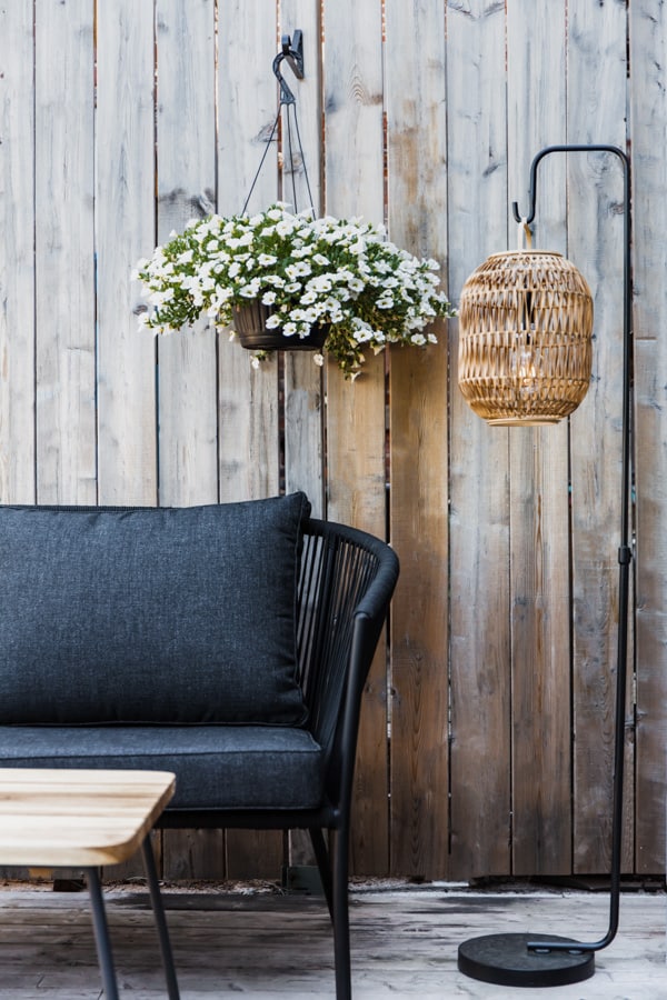 a patio sofa and lamp