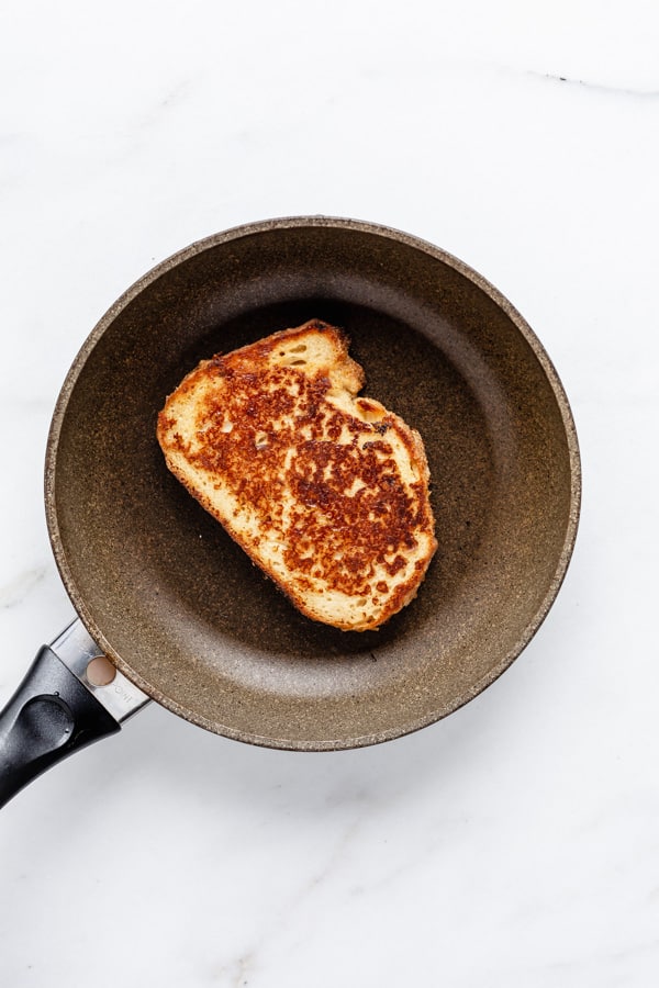 a pan with a piece of vegan french toast in it