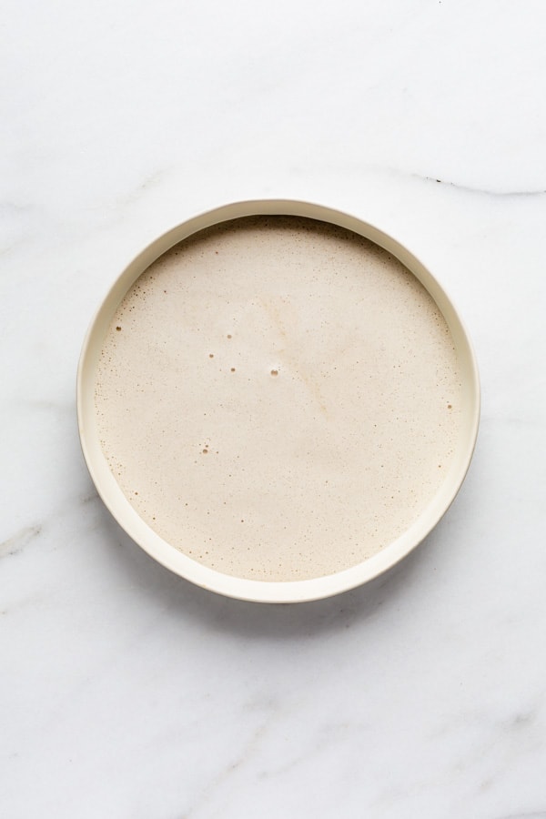 bowl of vegan french toast mixing liquid