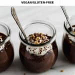3 cups of chocolate mousse with whipped cream and nuts on top