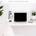 a desk with a laptop on it