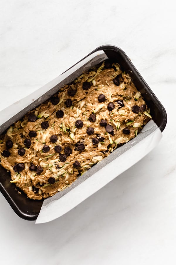 zuchinni bread batter spread in an 8x4 inch pan