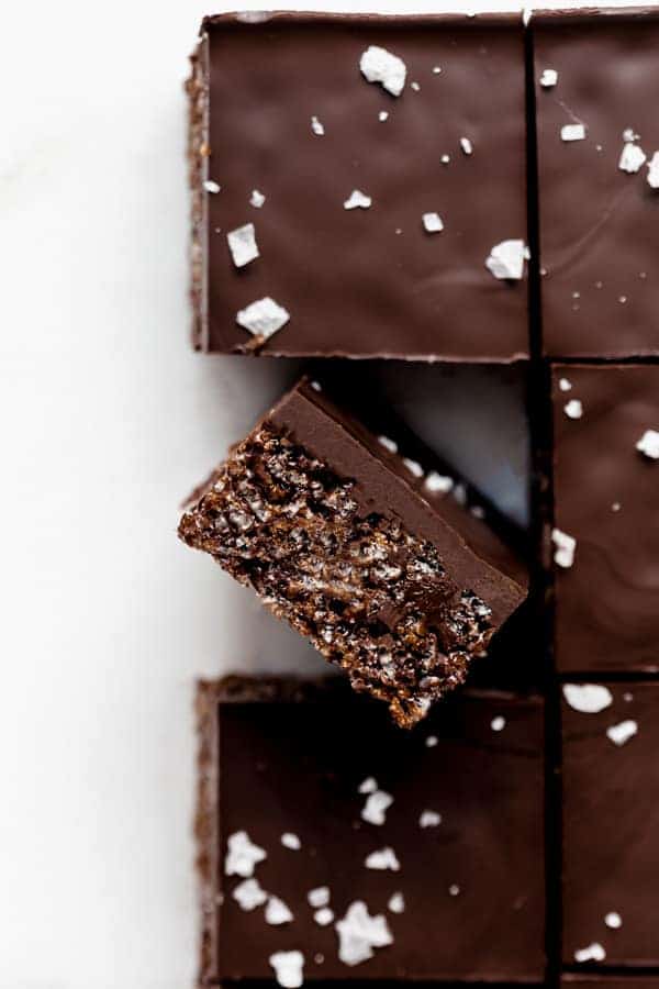 Rice Krispie treats cut in squares topped with flaked sea salt