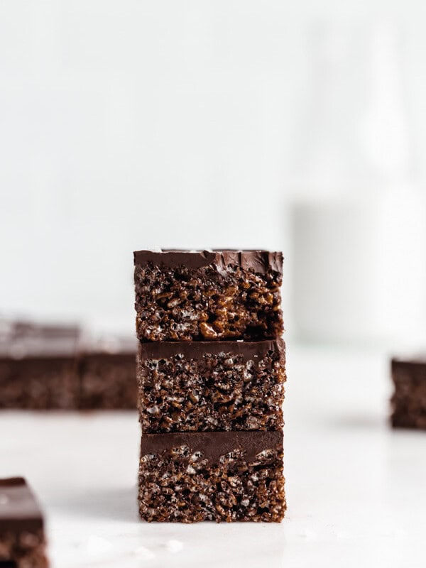 three chocolate rice Krispie treats stacked on top of each other