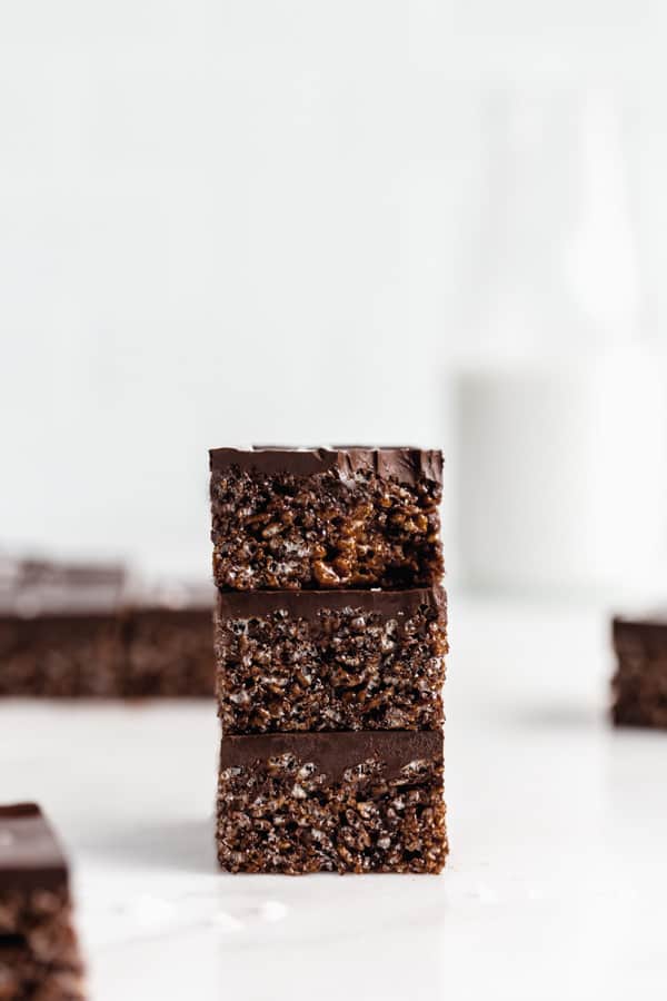 three chocolate rice Krispie treats stacked on top of each other
