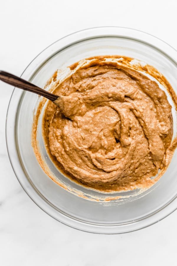 pumpkin bread batter in a clear mixing bowl