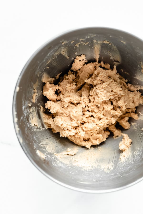 snickerdoodle cookie dough in a metal bowl