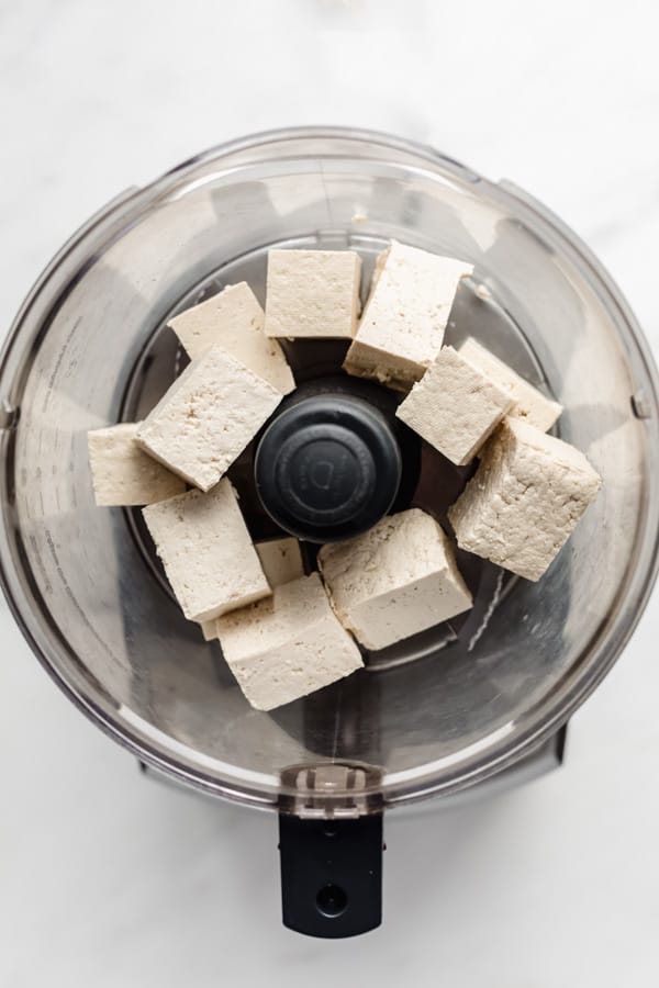 large cubes of tofu in a food processor