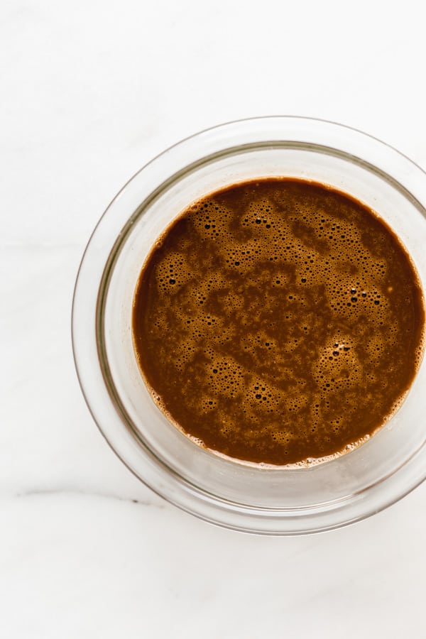 a bowl of wet ingredients to make gingerbread pancakes