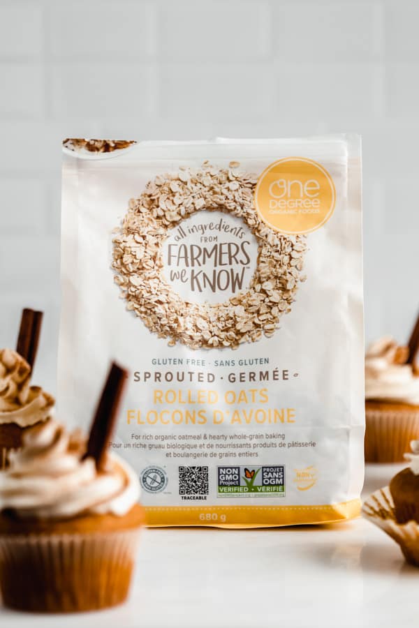 a bag of one degree organics sprouted rolled oats surrounded by pumpkin cupcakes
