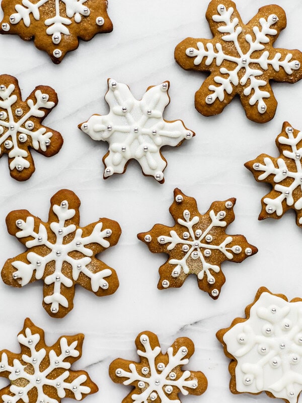 snowflake gingerbread cookies on a marble board