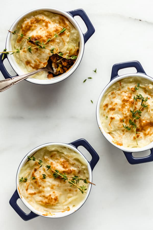 vegan lentil shepherd's pies in small blue ramekins