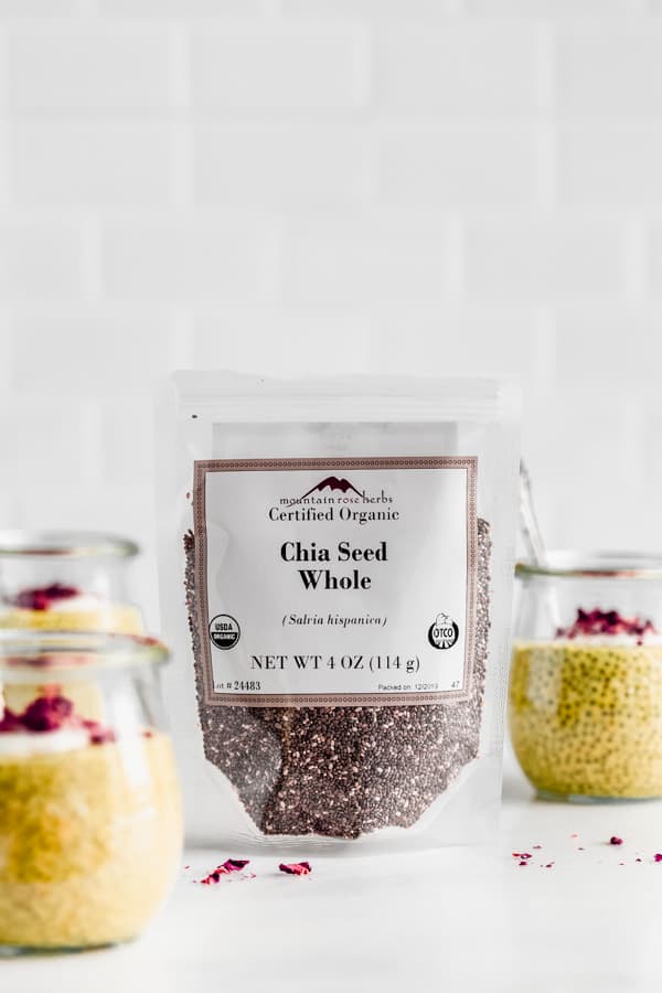 a package of chia seeds with jars of chia pudding around it
