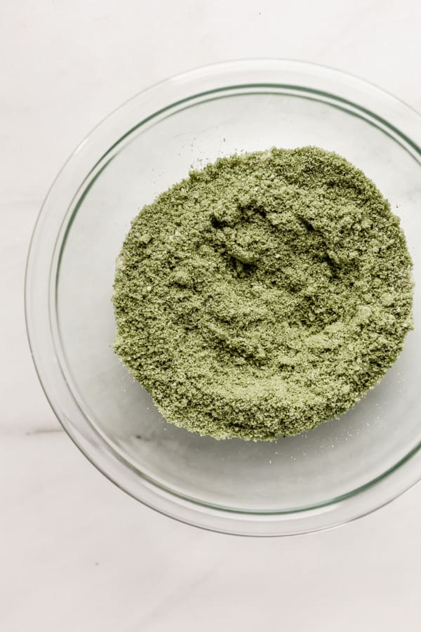 A bowl of matcha powder and almond flour