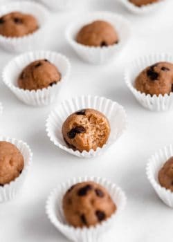 Chocolate chip cookie dough ball with a bite taken out of it