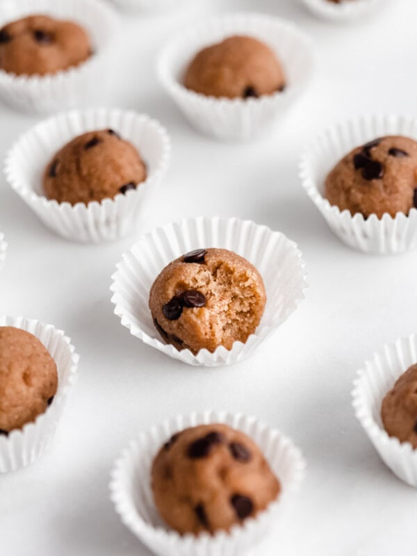 Chocolate chip cookie dough ball with a bite taken out of it