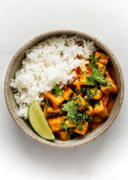a bowl of curry tofu and rice