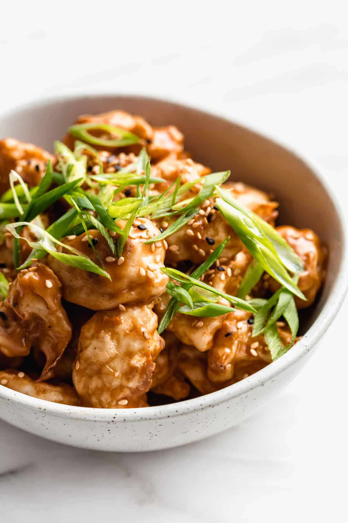 Thai peanut cauliflower wings in a bowl