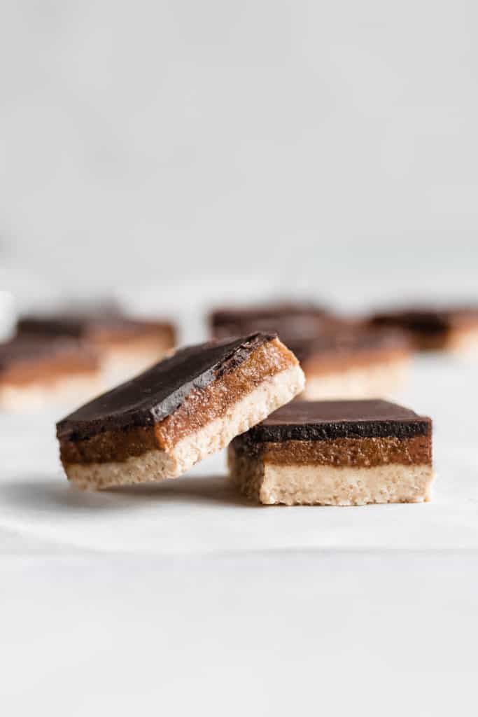 two raw salted caramel slices next to each other