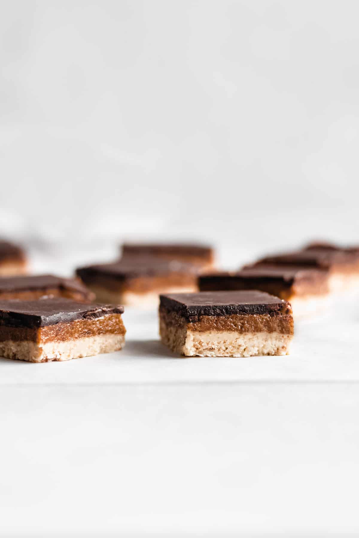 raw salted caramel slices on a marble board